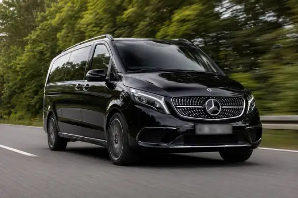 EasyLink executive chauffeur opening the door of a luxury vehicle